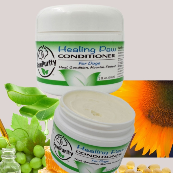 Healing Paw Conditioner by PawPurity surrounded in natural ingredients such as sunflower, grape, beeswax, vitamin E