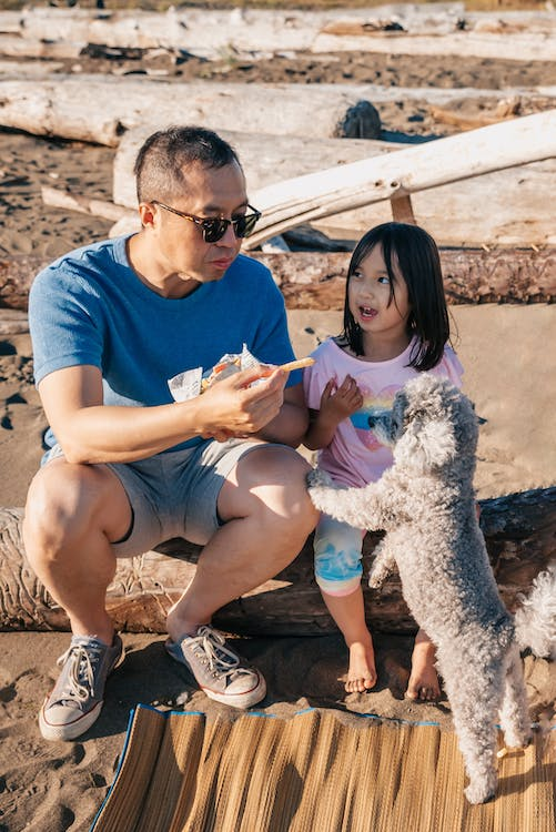 father with daughter and doggy